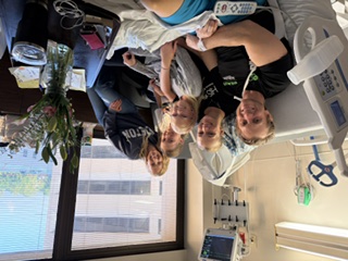 Nathan with his family in the hospital room