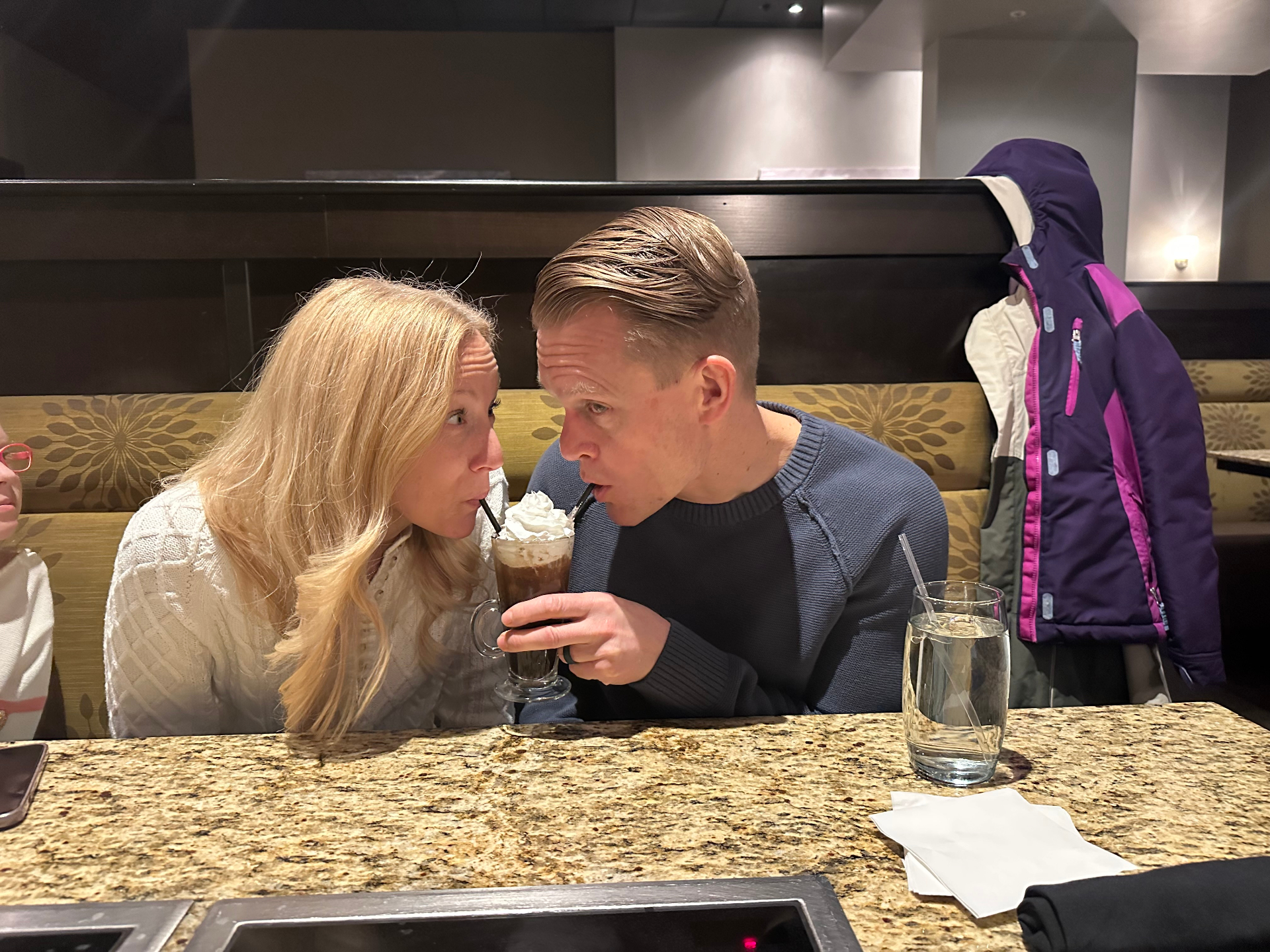 Nathan and Kim sharing a milkshake together
